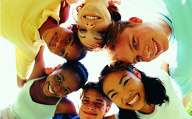 Diverse group of young people looking down at the camera