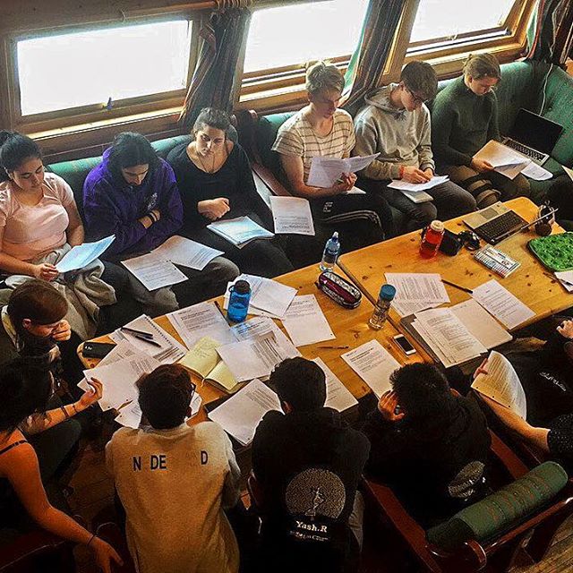 top down view of students around a table studying